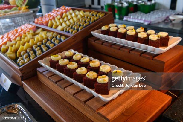 pastries and kuih in buffet line - kuih tart stock pictures, royalty-free photos & images