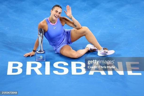 Aryna Sabalenka of Belarus poses with the winners trophy after winning the Women’s Finals match against Polina Kudermetova during day eight of the...