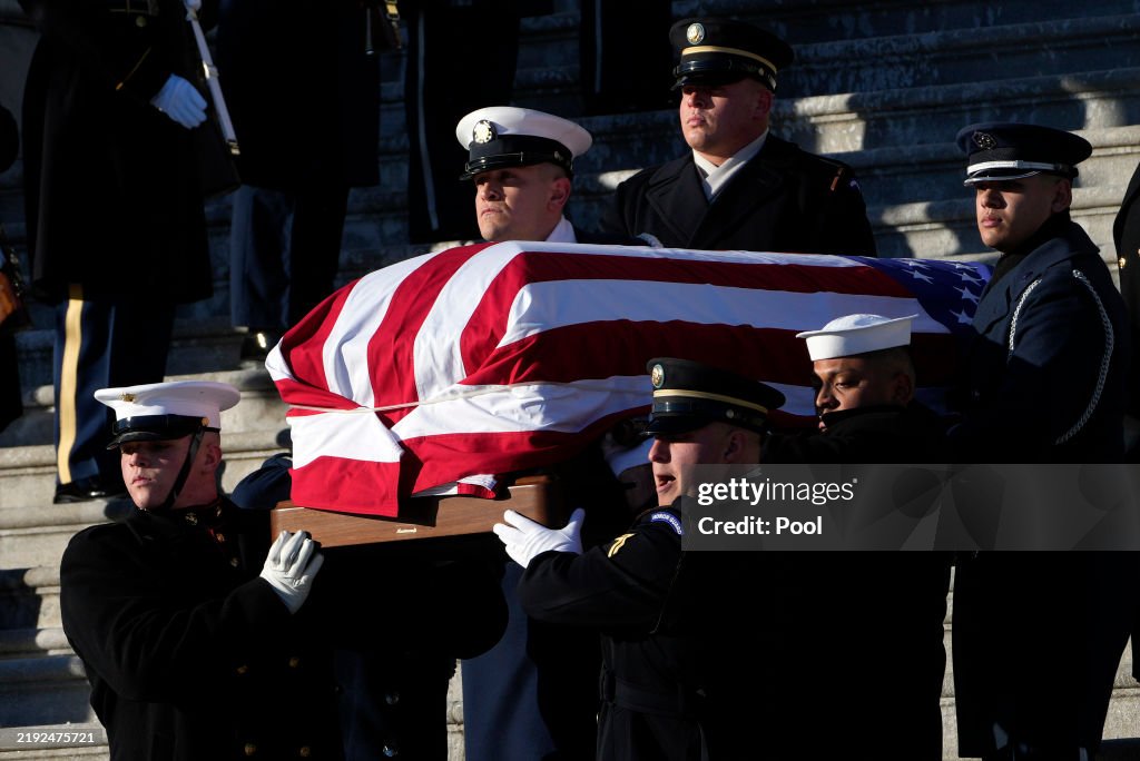 Body Of Former President Jimmy Carter Departs Capitol Building After Lying In State