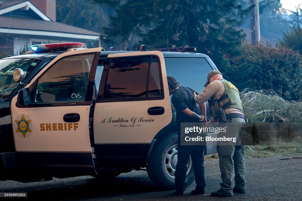 Thousands Flee From Uncontrolled Wildfires Burning Near LA