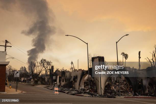 Businesses along Lake Avenue destroyed by the Eaton Fire in Altadena, California, on January 9, 2025. Wildfires threatened to engulf parts of...
