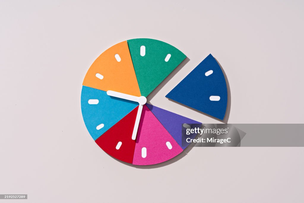 Multi Colored Time Clock Pie Chart Paper Craft HighRes Stock Photo