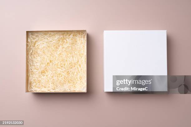 white gift box with lid opened on brown background - gift box stock pictures, royalty-free photos & images