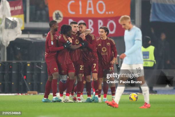 Lorenzo Pellegrini of AS Roma celebrates with team mates after scoring his team's first goal during the Serie A match between AS Roma and SS Lazio at...