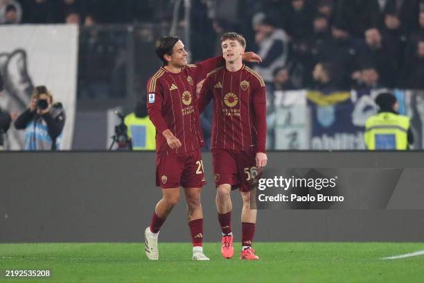 Alexis Saelemaekers of AS Roma celebrates scoring his team's second goal with Paulo Dybala during the Serie A match between AS Roma and SS Lazio at...
