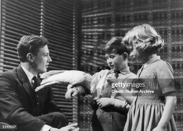 Prince Charles and Princess Anne meet naturalist David Attenborough at Lime Grove Studios on the 4th January, 1958. The young royals are introduced...