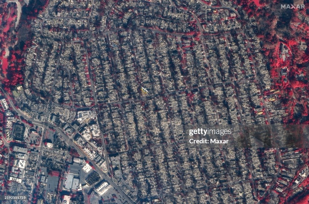 LOS ANGELES FIRES, CALIFORNIA -- JANUARY 9, 2025: Sequence image 05. Maxar AFTER I.R. satellite imagery of additional homes of the destruction in Pacific Palisades, Los Angeles, California. Note: Red indicates healthy green vegitation. Please use: Sate