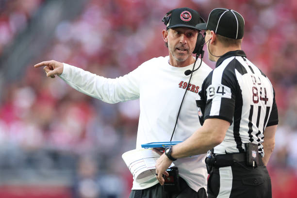 Head coach Kyle Shanahan of the San Francisco 49ers talks to a referee during the first half against the Arizona Cardinals at State Farm Stadium on...