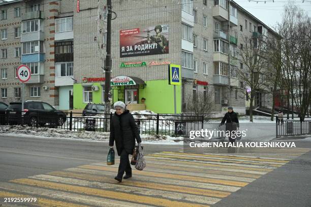 Placard promoting contract army service and reading "I am for the Motherland!" sits on the wall of a residential building in the town of Petushki in...