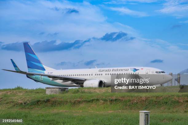 Plane of Garuda Indonesia taxis at Soekarno-Hatta international airport in Tangerang on January 10, 2025.