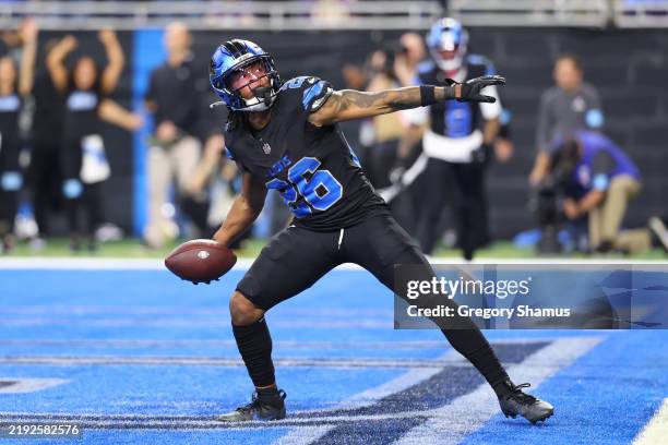 Jahmyr Gibbs of the Detroit Lions celebrates a touchdown during the third quarter against the Minnesota Vikings at Ford Field on January 05, 2025 in...