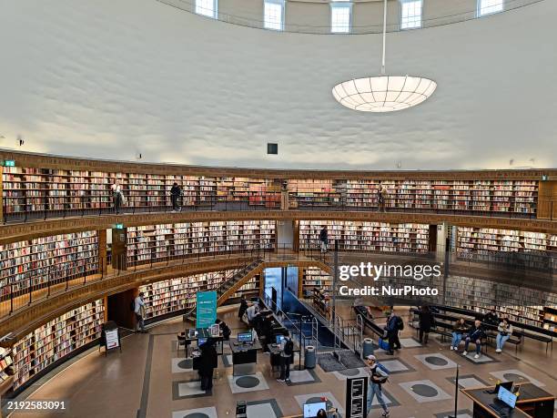 In Stockholm, Sweden, on September 29 the Stockholm Public Library, a renowned architectural landmark, features a spacious circular hall with...
