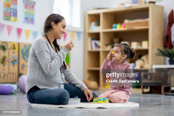 learning through play - occupational therapy stock pictures, royalty-free photos & images