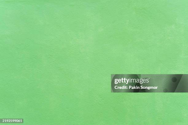rough green cement wall. texture as background. - green paper texture stock pictures, royalty-free photos & images