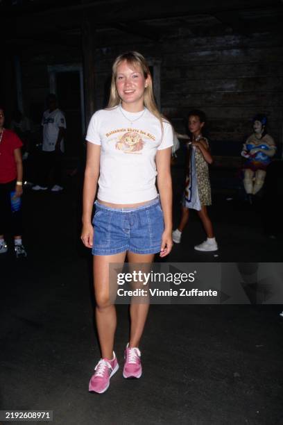 American singer and actress Hoku, wearing a 'Matsumoto Shave Ice Girls' t-shirt and denim shorts, attend the KIIS FM 102 7 Concert at Knott's Berry...