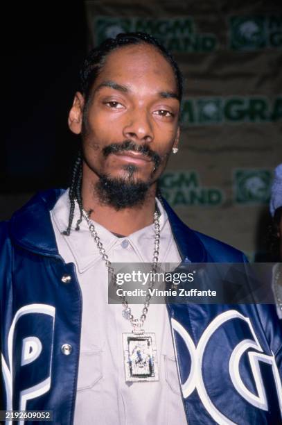 American rapper and actor Snoop Dogg, wearing a blue jacket over a grey shirt, attends the 10th Billboard Music Awards at the MGM Grand Garden Arena...