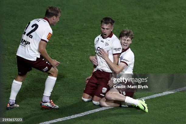 Luka Jovanovic of Adelaide United celebrates with team mates after scoring a goal during the round 12 A-League Men match between Macarthur FC and...
