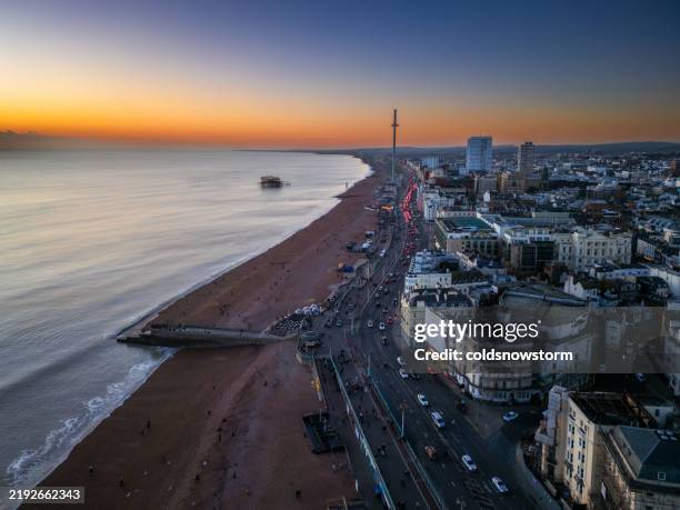 aerial view of seafront at dusk in brighton, uk - promenade stock pictures, royalty-free photos & images