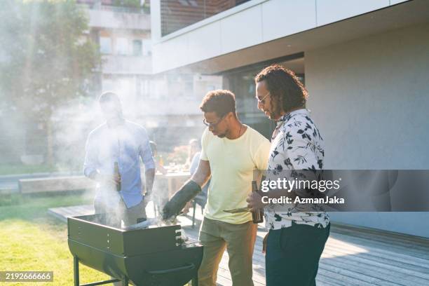 barbecue party with friends during summer - protective glove stock pictures, royalty-free photos & images