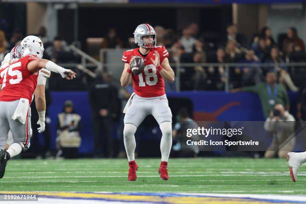 Quarterback Will Howard of the Ohio State Buckeyes passes during the Ohio State Buckeyes versus Texas Longhorns College Football Playoff Semifinal at...