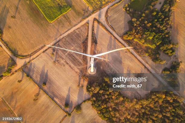 aerial view of part of windmill turbine in countryside, green energy - golden hour stock pictures, royalty-free photos & images