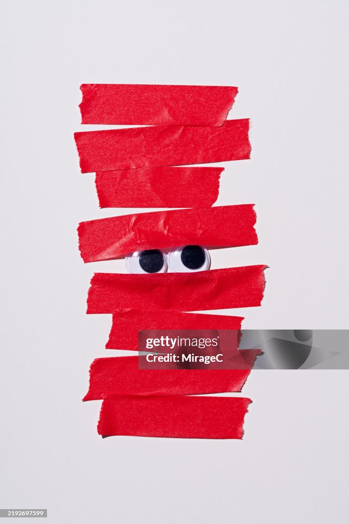 Googly Eyes Covered by Red Tape, Bureaucracy Concept