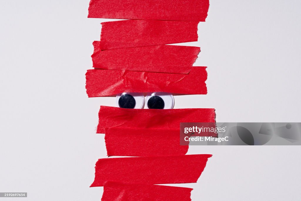 Googly Eyes Covered by Red Tape, Bureaucracy Concept
