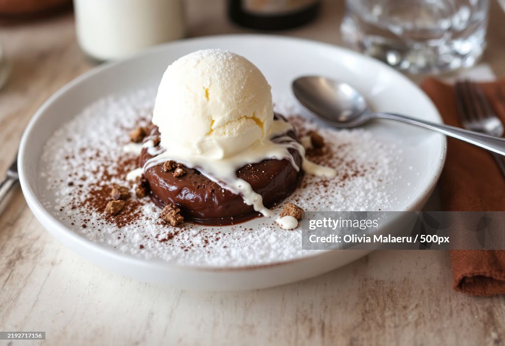 A photo of a chocolate lava dessert with ice cream