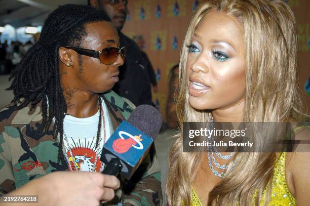 Rappers Lil Wayne and Trina attend the 2005 MTV Video Music Awards at the American Airlines Arena on August 28, 2005 in Miami, Florida.