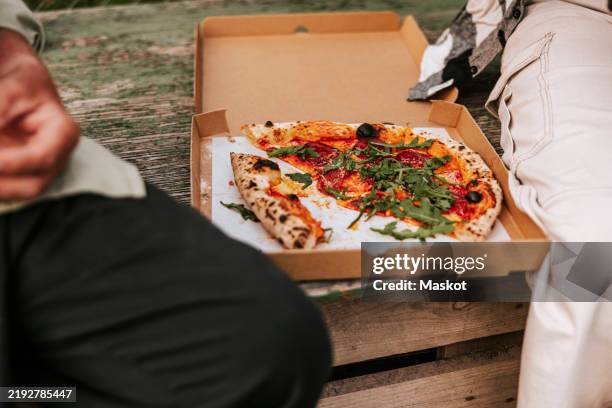 pizza box kept on table - pizza box stock pictures, royalty-free photos & images