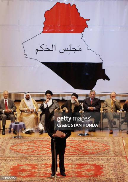 United Nations special representative Sergio Vieira de Mello speaks on stage with members of the first Iraqi National Executive Body since US led...