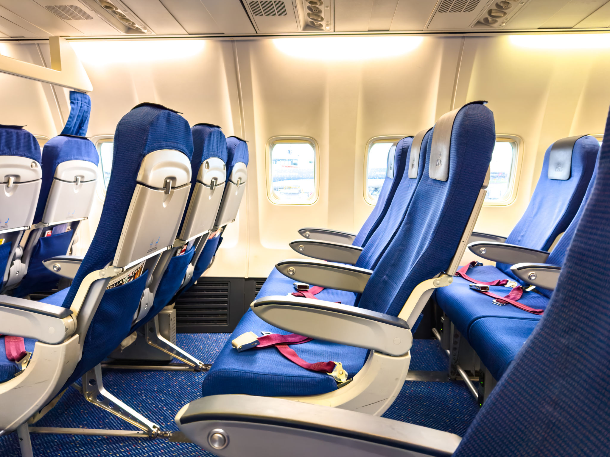 Empty airplane cabin interior passenger seats Empty airplane cabin interior passenger seats