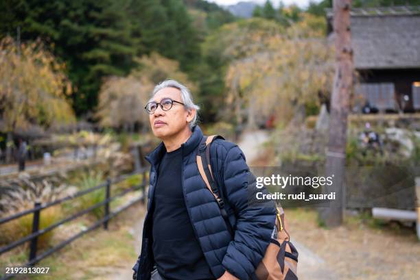 old man walking an explore fujikawaguchiko town, japan - white hair asian man stock pictures, royalty-free photos & images