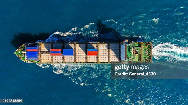 aerial top view cargo container ship at blue sea. - tankschiff stock-fotos und bilder