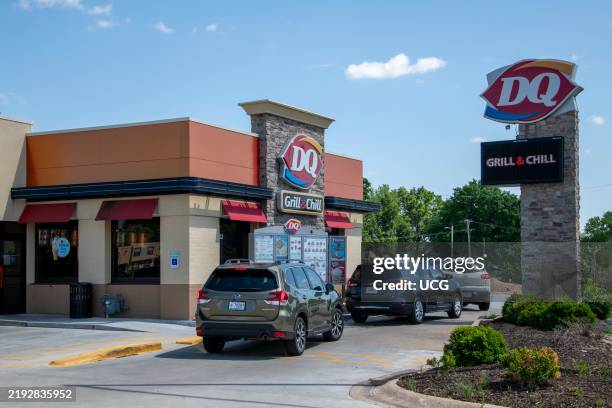 Lansing, Kansas. Cars line up in the drive thru lane to pick up their food at the local Dairy Queen.