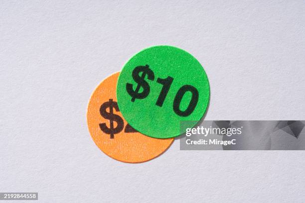 covered price stickers with price reductions to 10 dollars - precio fotografías e imágenes de stock