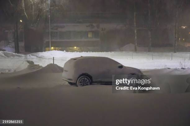 the snowdrift is going to make it hard to get the car out of the parking lot - flip over stock pictures, royalty-free photos & images