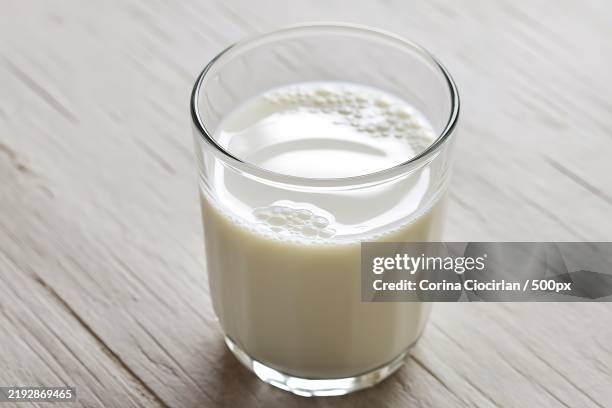 a photo of a glass filled with fresh milk - glass of milk stock pictures, royalty-free photos & images