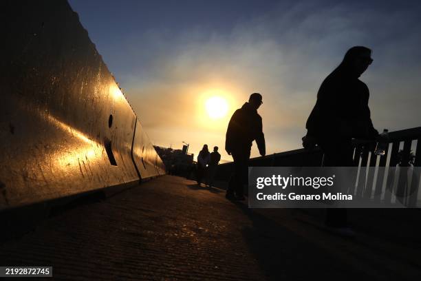 Crowds were sparse on the Santa Monica Pier due to poor air quality and the fires in Santa Monica on January 11, 2025.