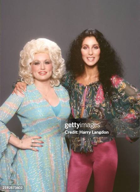 Singer and actress CHER poses with Dolly Parton for a portrait in 1978 in Los Angeles, California.
