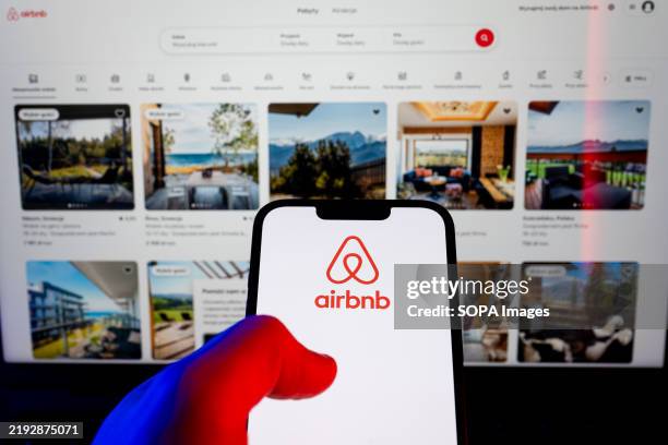 In this photo illustration, an Airbnb logo seen displayed on a smartphone.