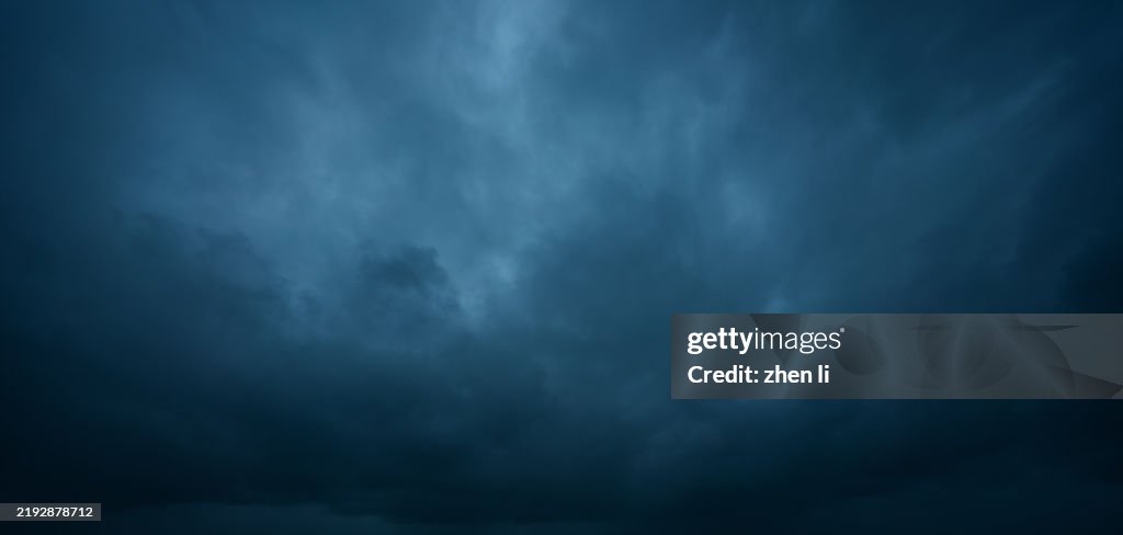 Black clouds gather overhead