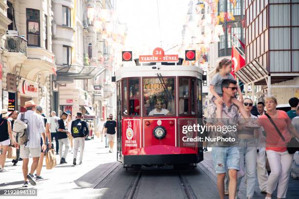 The red nostalgic tram operates on the Taksim-Tunel Nostalgia Tramway in Istanbul, Turkey, on June 9, 2024.
