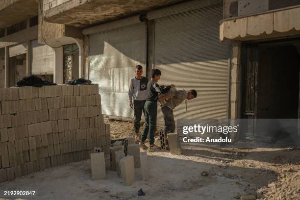 People work on reconstruction of destroyed buildings as return of the civilians has started in Syria on January 9, 2025. Homs, which is strategically...