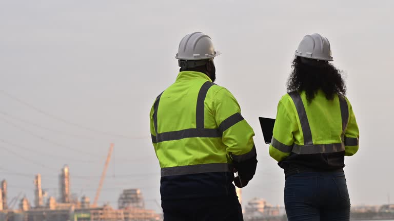 https://media.gettyimages.com/id/2192903746/video/engineers-wearing-safety-gear-including-hard-hats-examining-survey-a-standing-industrial.jpg?b=1&s=640x640&k=20&c=RMctBk2vCPaaav7oihy922eQA9CM46tP92-xALLwmz4=