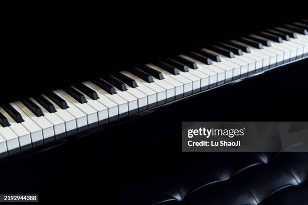 piano and piano keyboard with black backgrounds. - piano key stock pictures, royalty-free photos & images