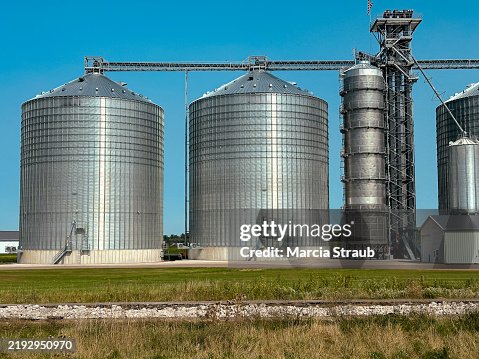 Silver Grain Silos by the Railroad Tracks Silver Grain Silos by the Railroad Tracks