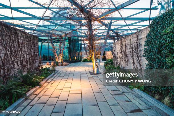 a rest stop in a park in the heart of a modern city, london - commercial landscaping equipment stock pictures, royalty-free photos & images