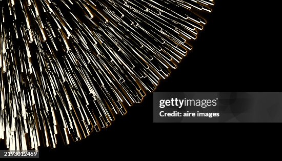 Golden light trails exploding from a dark background Golden light trails exploding from a dark background