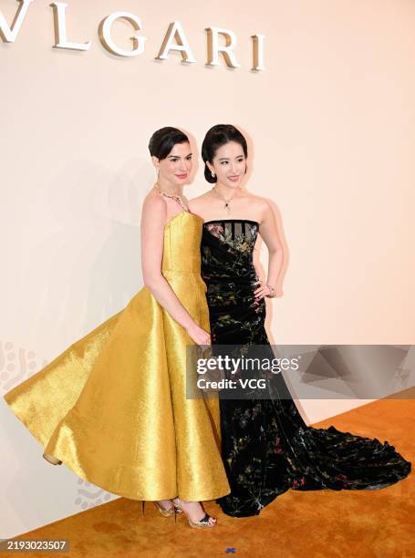 Actress Anne Hathaway and actress Liu Yifei attend the opening ceremony of Bvlgari Infinity Serpents Exhibition on January 8, 2025 in Shanghai, China.